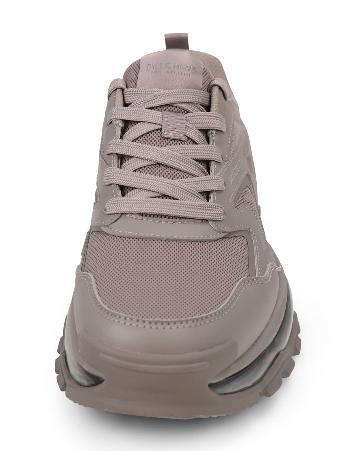 A single taupe-brown athletic sneaker shown from a front-facing perspective on a clean white background. The shoe features a chunky, multi-layered sole with visible air cushioning, mesh panels, and matching laces.
