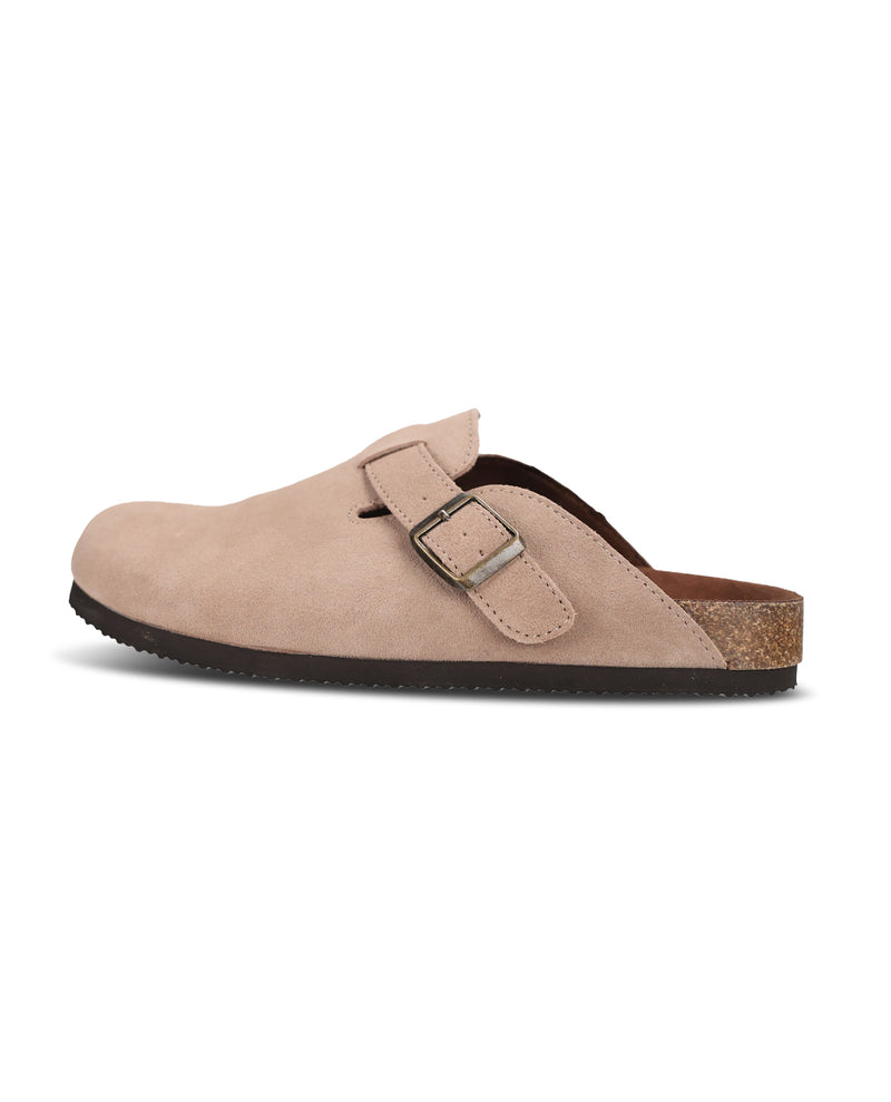 A single light beige suede clog shoe with a double strap buckle closure, dark brown sole, and cork heel, shown from a side profile on a white background.