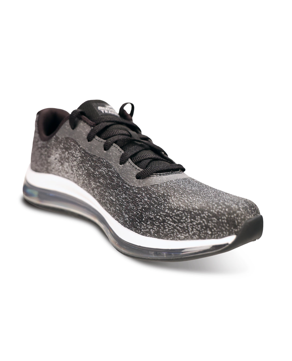 A single athletic sneaker shown from a three-quarters angle on a white background. The shoe features a textured, speckled dark gray and black upper, black laces, a white midsole, and a clear heel cushioning unit.