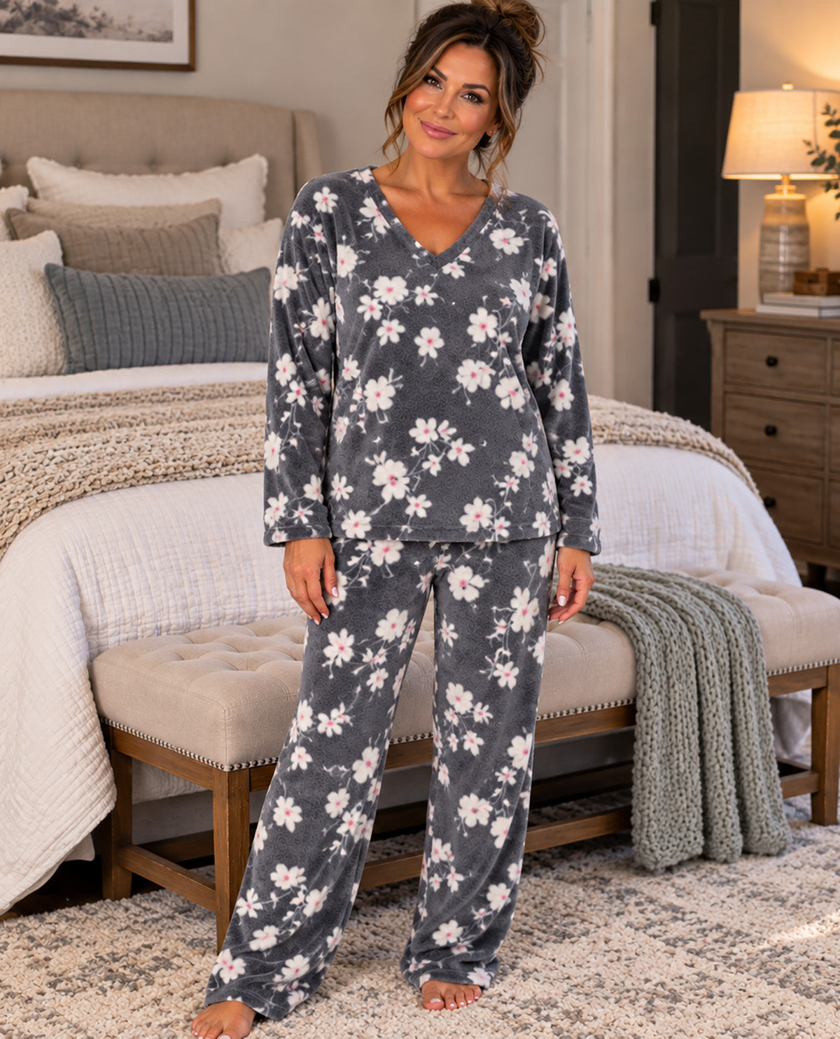 Missy model wearing a gray floral long sleeve pj set with a bedroom background