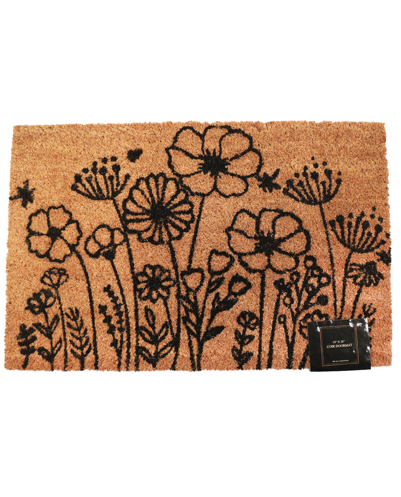 A rectangular natural coir doormat featuring a black line-art floral and botanical pattern, with a small black brand tag attached at the bottom right, shown on a plain white background.