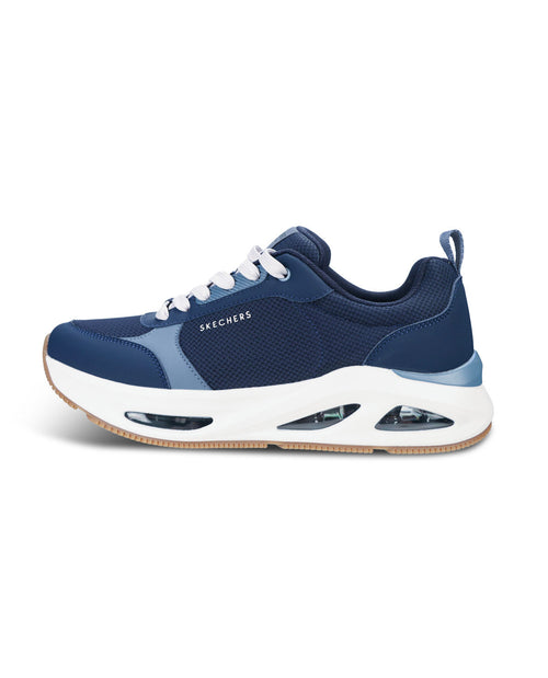 A navy blue Skechers sneaker with a chunky white midsole featuring visible air cushioning chambers, white laces, and a light blue accent panel on the side, shown against a plain white background.