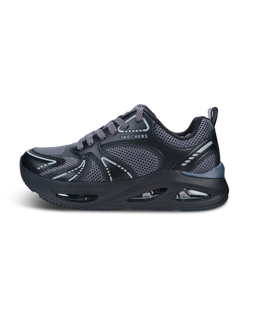 A Skechers athletic sneaker in dark gray and black, featuring a breathable mesh upper, gray laces, and a thick cushioned black sole with visible air cushioning chambers, shown against a plain white background.