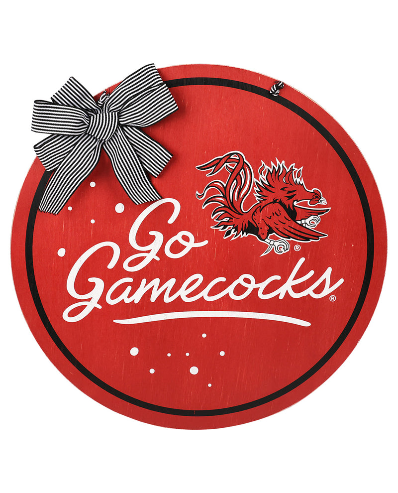 Circular red sign with 'Go Gamecocks' text and gamecock logo, featuring a bow on top.
