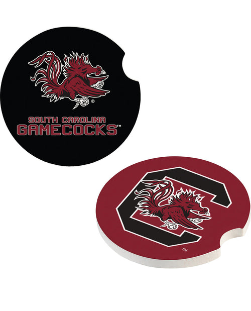 Two round coasters with South Carolina Gamecocks branding, one black with a red and white logo and text, and one red with a black and white C logo and bird graphic, shown on a white background.
