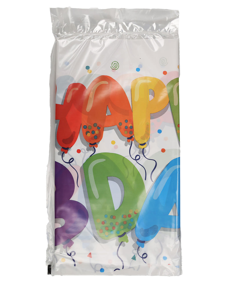 A clear plastic bag of disposable table linens featuring a colorful 'HAPPY BIRTHDAY' balloon print in red, orange, yellow, green, purple, and blue on a white background.