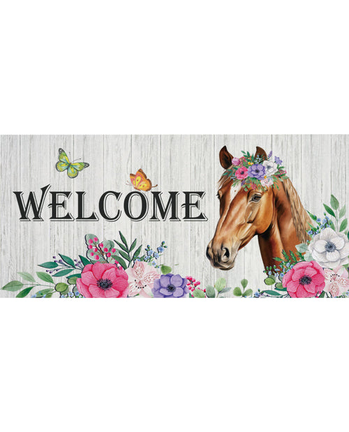 Decorative welcome sign with a horse, flowers, and butterflies on a wooden background.