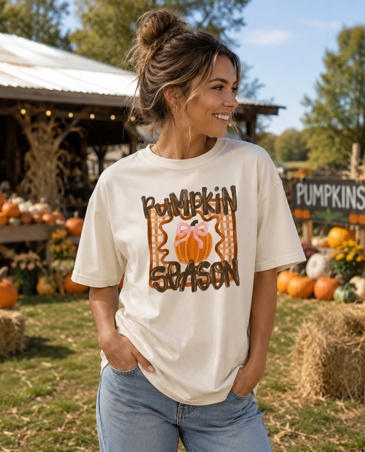 Woman wearing a 'Pumpkin Season' t-shirt at a pumpkin patch.