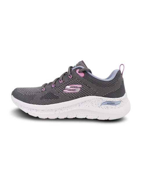 A Skechers athletic sneaker in dark gray mesh with pink accents on the laces, logo, and heel pull tab, featuring a white speckled cushioned sole.