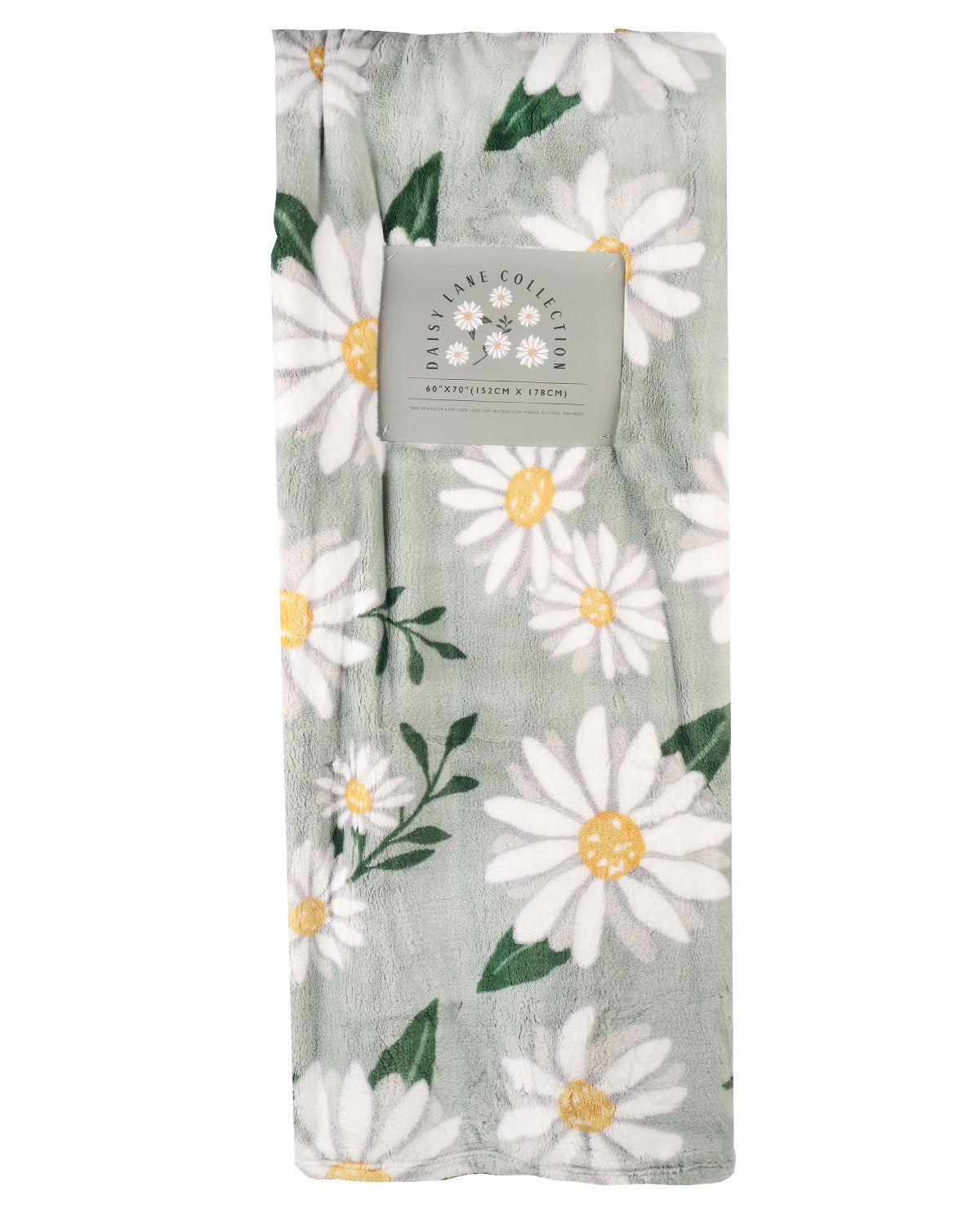 A folded plush blanket from Daisake Cozy Cards featuring a daisy floral pattern on a sage green background, with a gray paper brand label attached near the top.