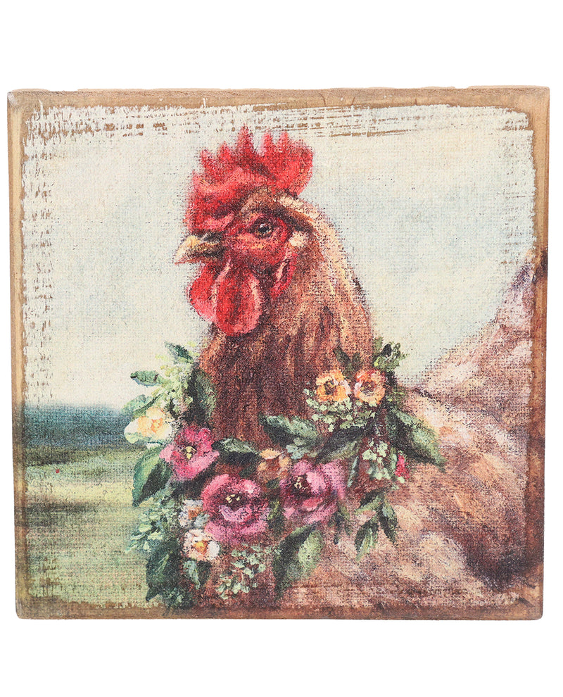 Decorative wall art with a rooster and floral wreath on a rustic background