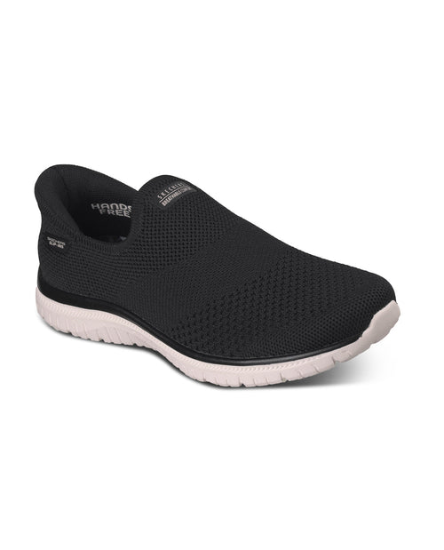 Black slip-on shoe with white sole on a white background