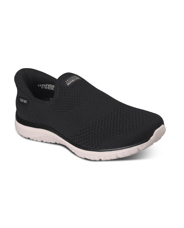 Black slip-on shoe with white sole on a white background