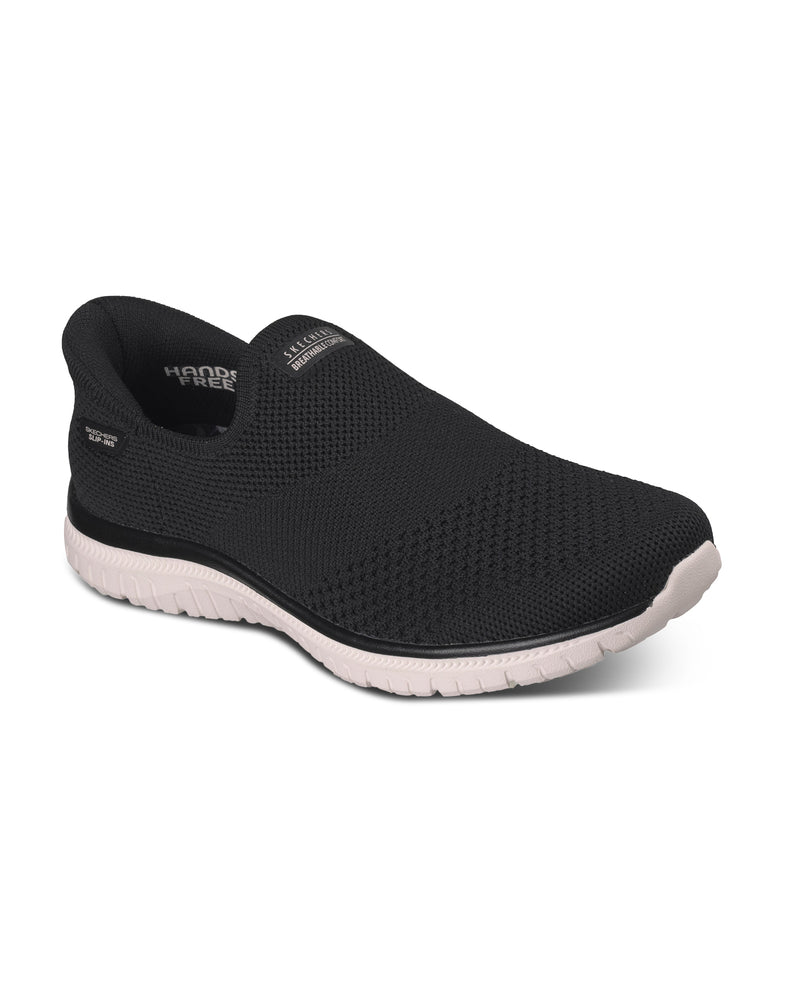 Black slip-on shoe with white sole on a white background