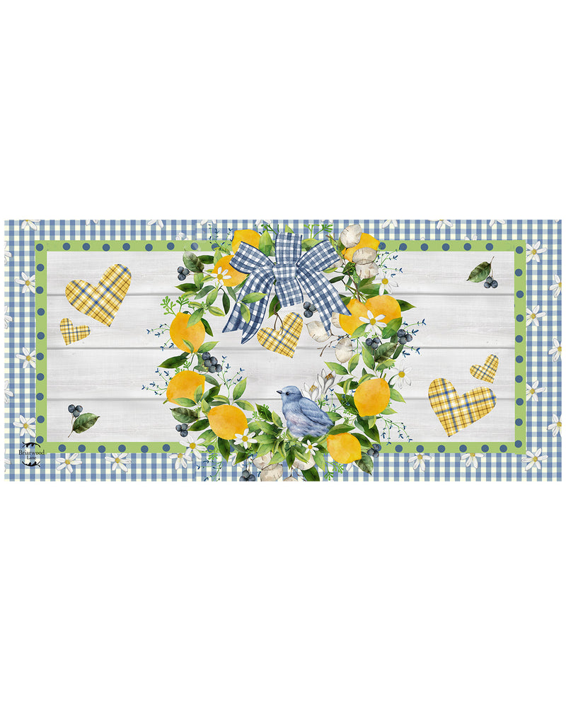 Decorative table runner with lemons, blue ribbons, and checkered border on a white background