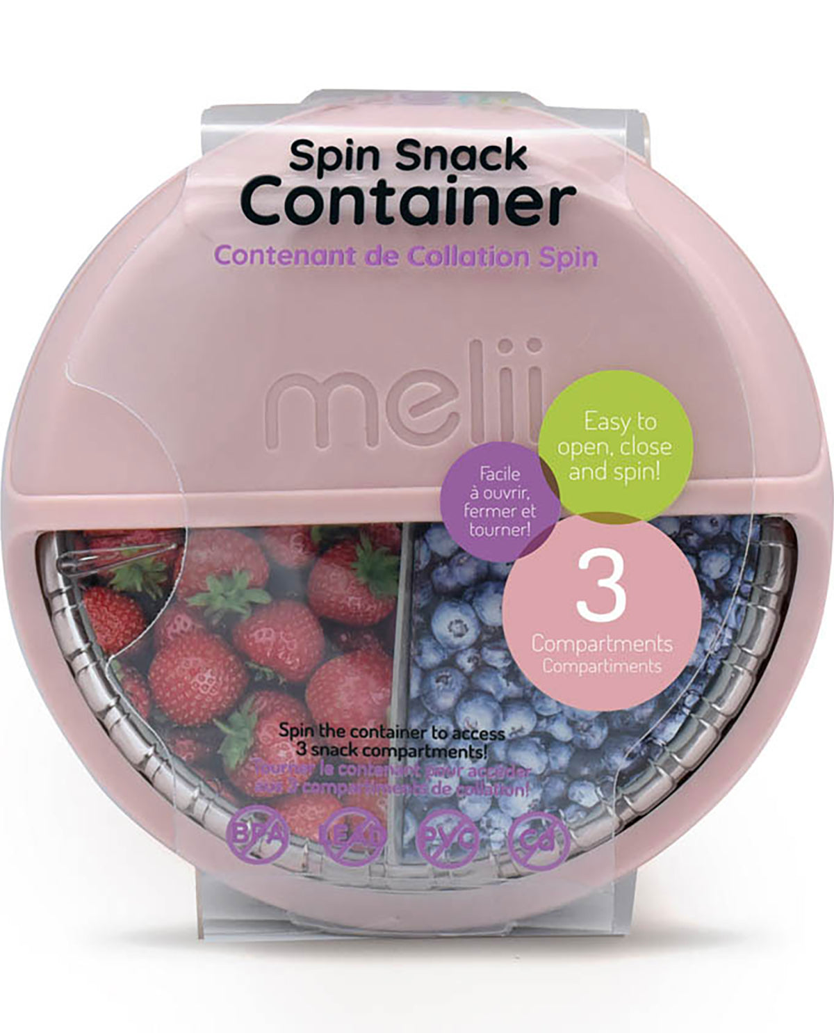 Pink spin snack container with compartments of strawberries and blueberries on a white background