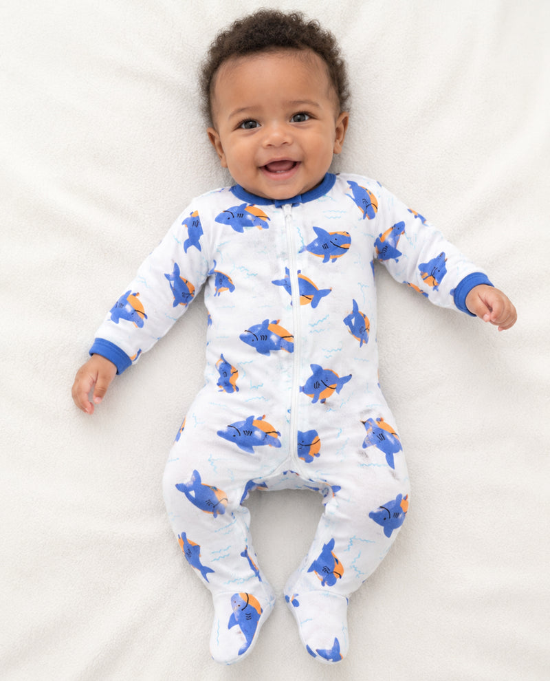 Baby boy wearing long sleeve coveralls with shark print
