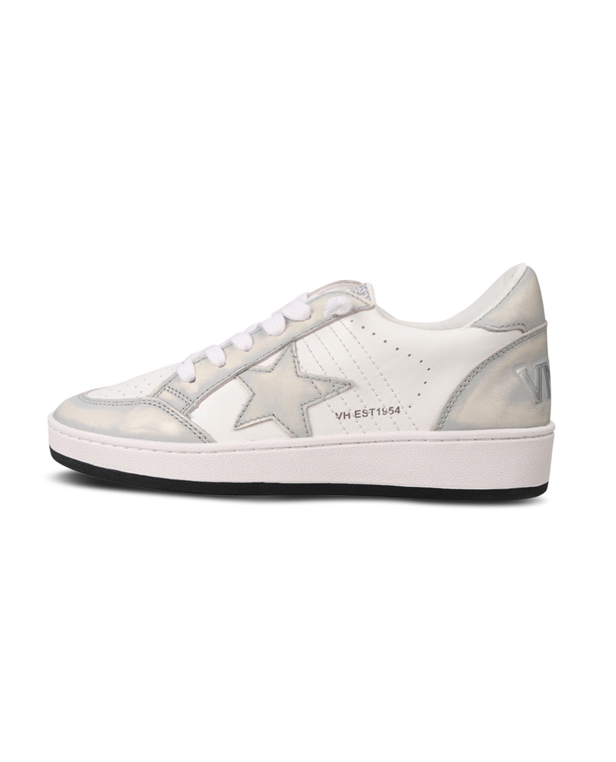 A low-top sneaker in white and metallic silver, featuring a large star patch on the side, white laces, and a thick white midsole with a black outsole.