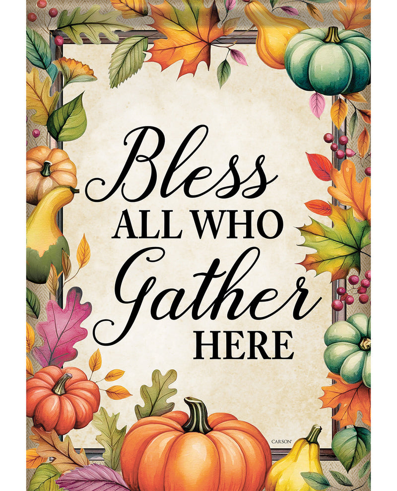 An autumn-themed decorative sign with the phrase “Bless All Who Gather Here” in black script and serif text on a cream background, surrounded by illustrated pumpkins, gourds, leaves, and berries in fall colors.