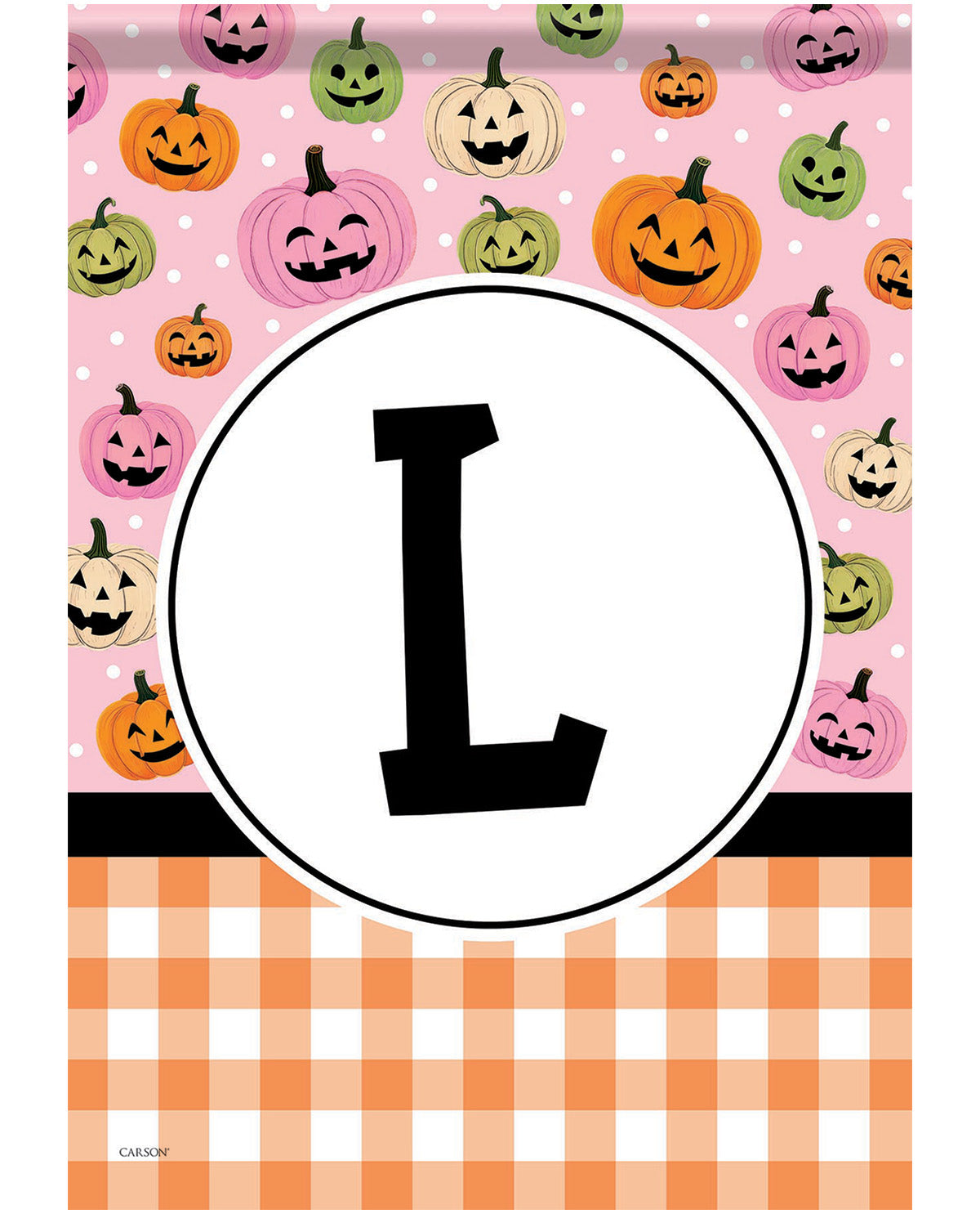 A square decorative print featuring a pink background with a repeating pattern of smiling jack-o'-lantern pumpkins in orange, green, and pink. A large black letter L is centered inside a white oval in the middle.
