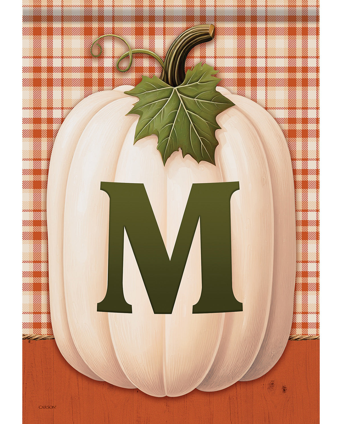 A decorative autumn flag or sign featuring a large cream-colored pumpkin with a dark green leaf and stem, overlaid with a bold dark green letter M. The background includes an orange and white plaid pattern at the top and a solid orange-brown wood texture at the bottom.