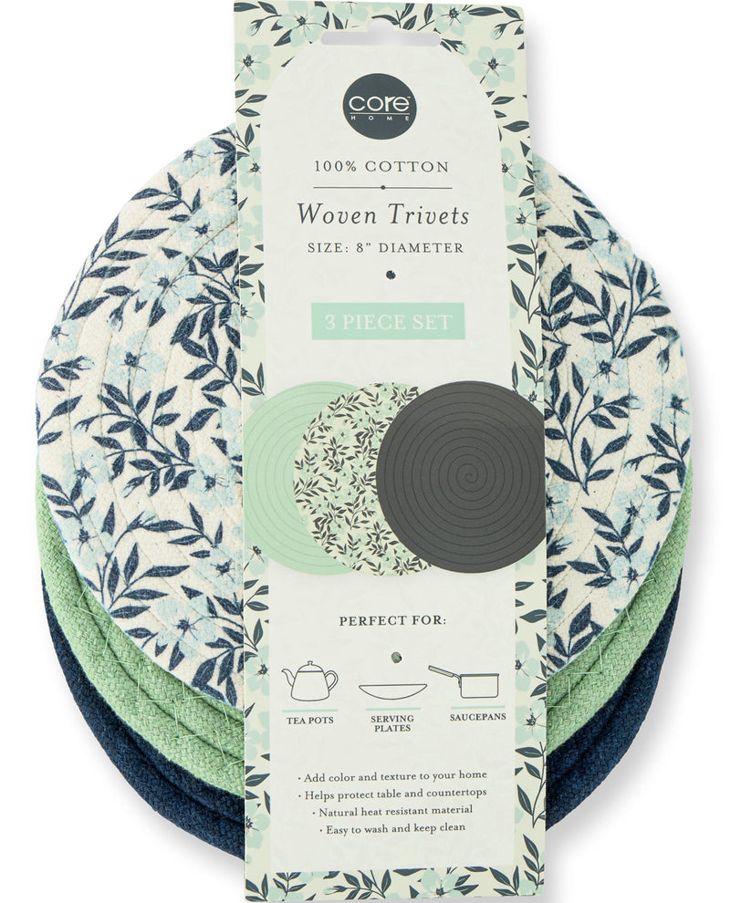 A 3-piece set of Core Design Woven Trievets in a botanical pattern, shown with their retail packaging card on a white background.