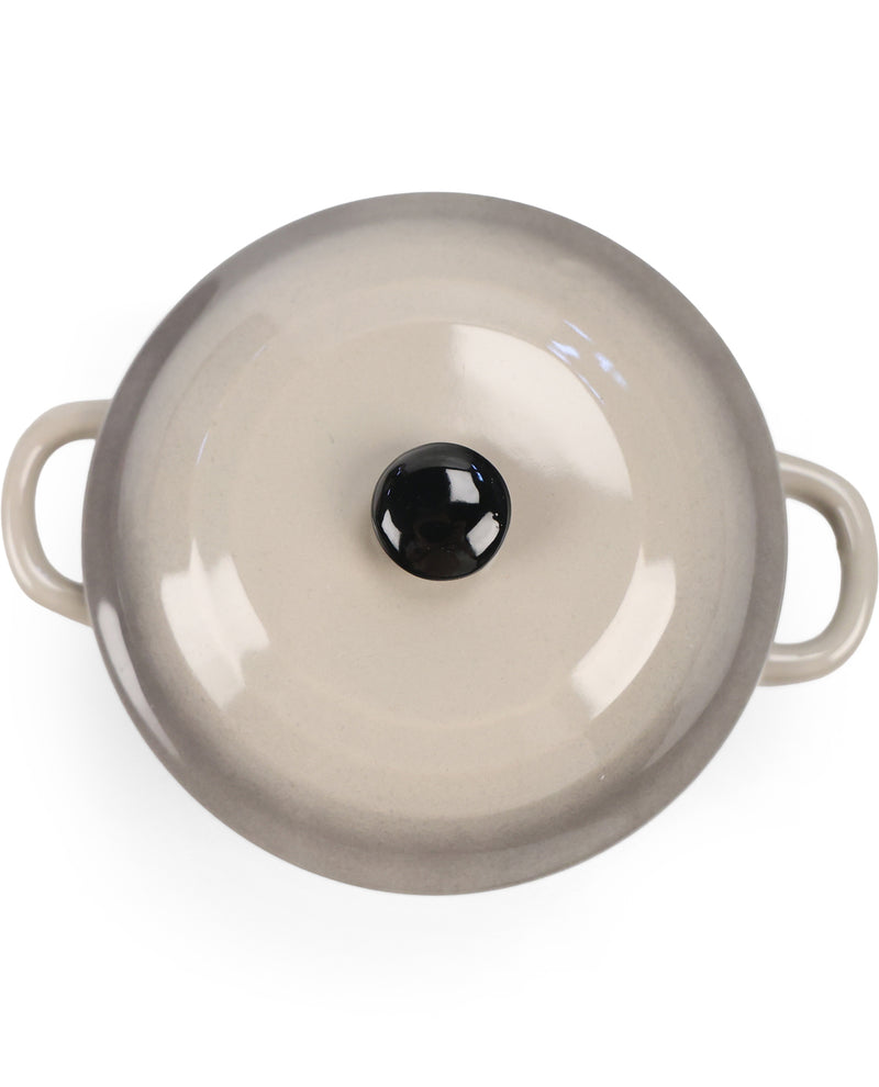 A top-down view of a round ceramic pot or casserole dish with two side handles and a matching lid featuring a black knob, set against a plain white background.