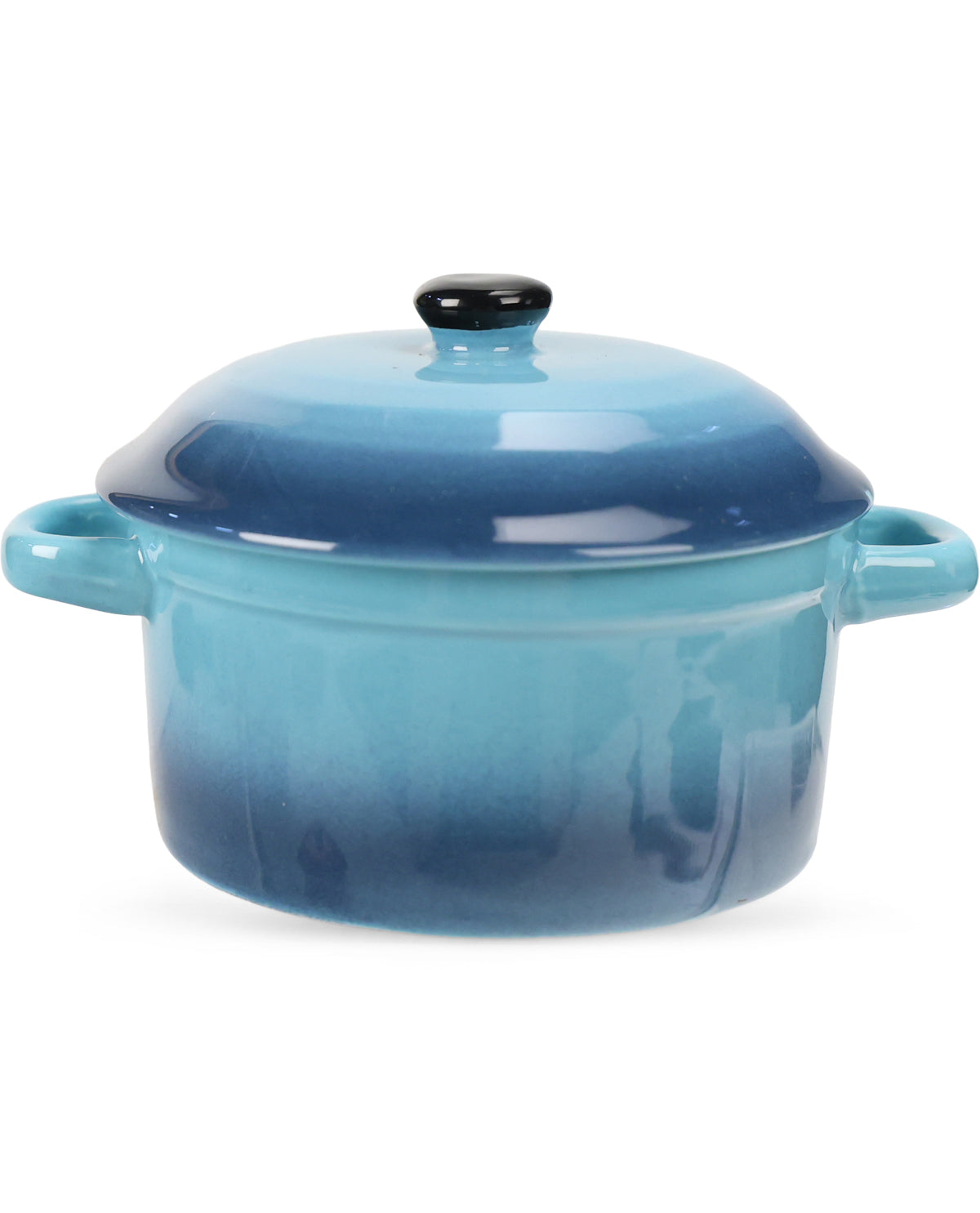 A ceramic lidded casserole or stockpot with side handles, featuring a glossy blue gradient that fades from light aqua at the top to deep navy at the bottom, with a small black knob on the lid, set against a plain white background.