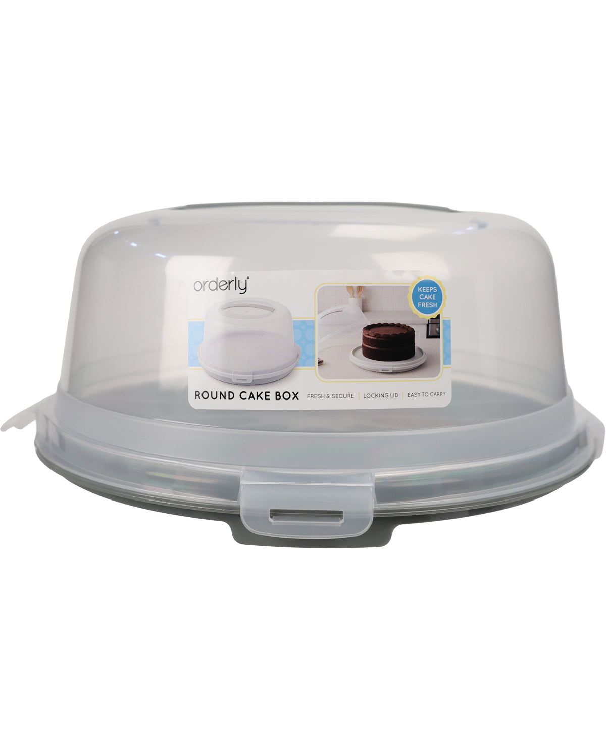 A clear plastic round cake box with a translucent lid and a gray locking tab on the front, shown on a plain white background. A product label is attached to the front.