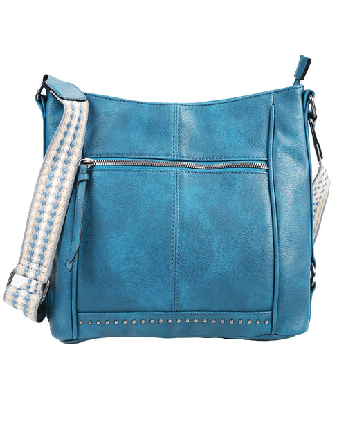Blue leather handbag with studded details on a white background