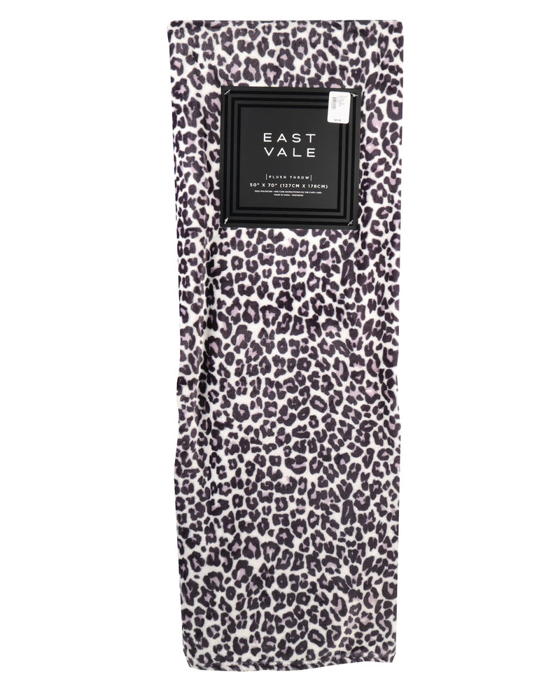 Leopard print travel towel with East Vale label on a white background