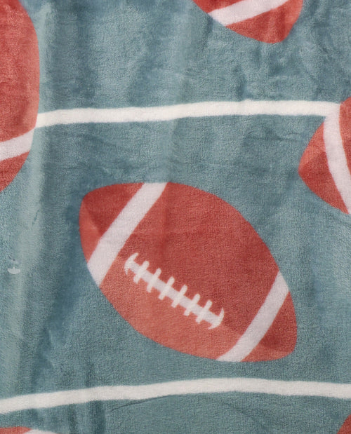 Fabric with red football pattern on a blue background