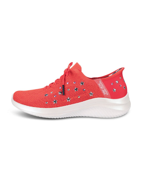 A red knit athletic sneaker with star-shaped embellishments on the side, a red heel tab, and a thick white sole, shown from a side profile on a white background.