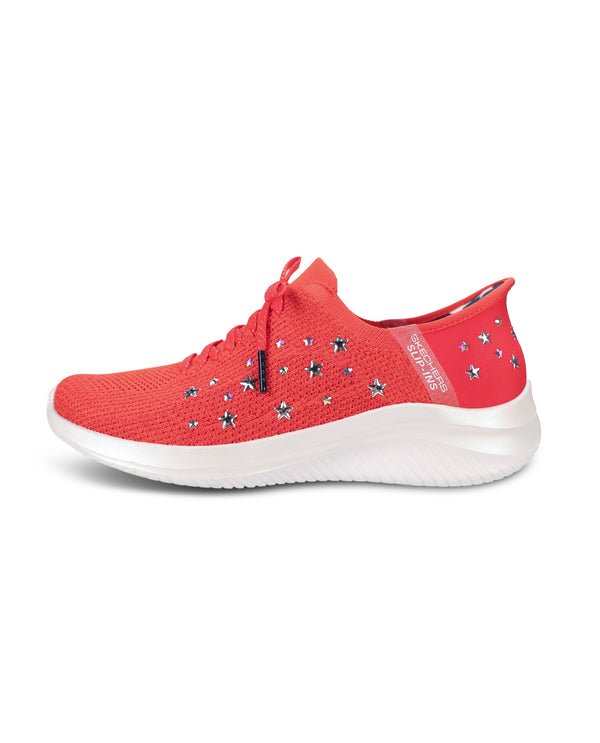 A red knit athletic sneaker with star-shaped embellishments on the side, a red heel tab, and a thick white sole, shown from a side profile on a white background.