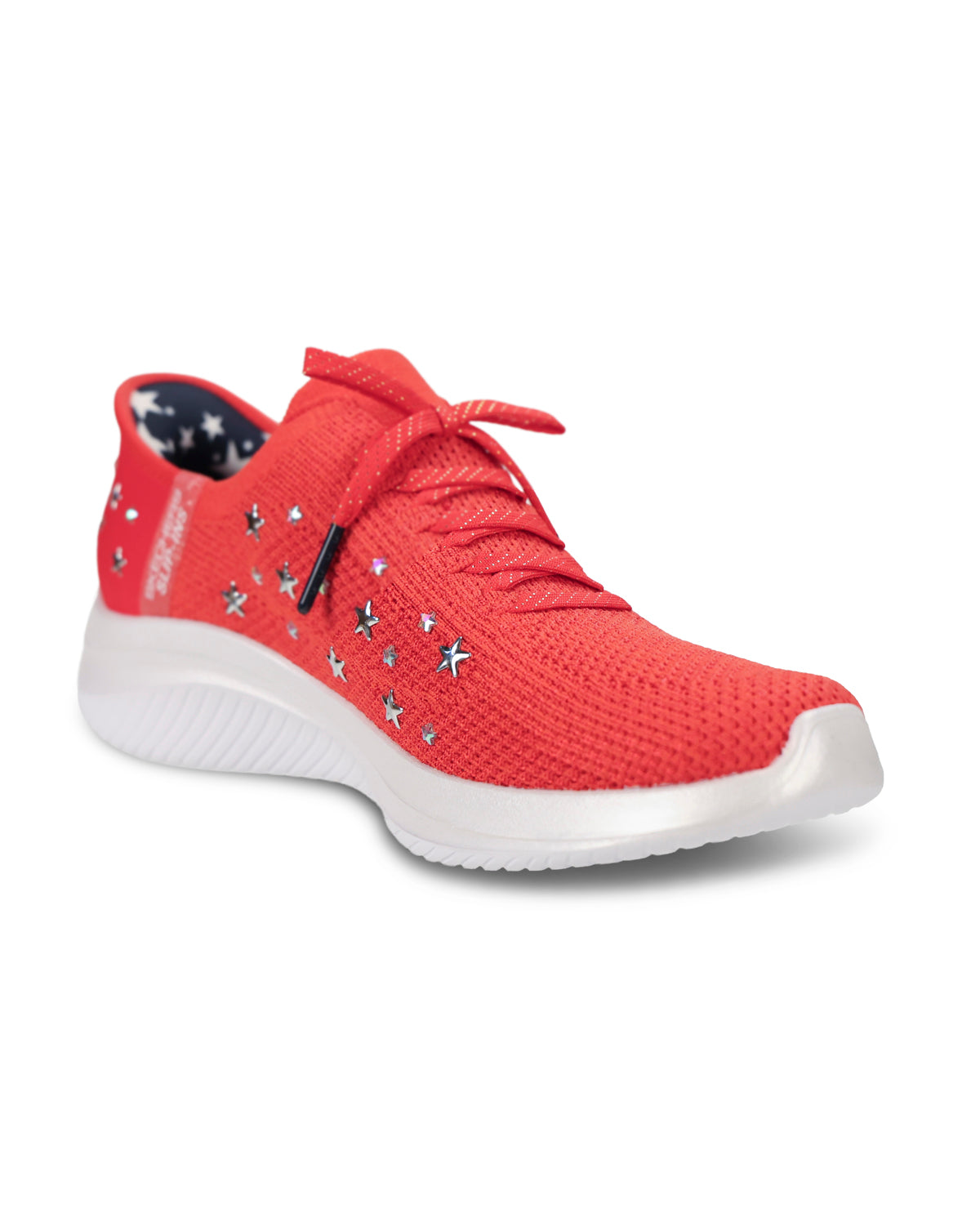 A red knit athletic sneaker with silver star-shaped studs and a thick white sole, shown from a three-quarters angle on a white background.