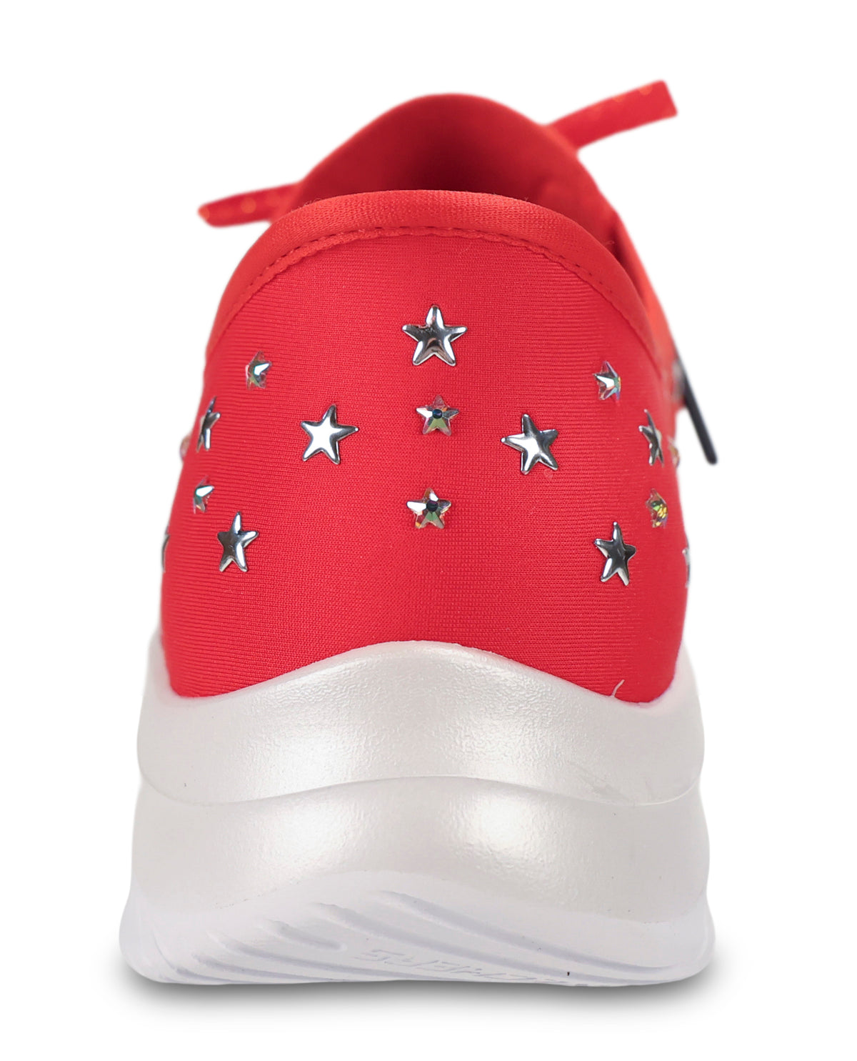 A red slip-on sneaker with metallic silver star-shaped studs and a thick white sole, shown from a rear three-quarter view on a white background.