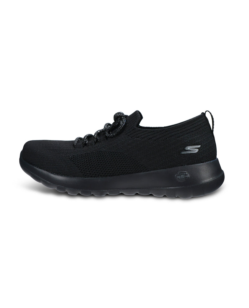 A black knit slip-on sneaker with textured laces and a thick black sole, shown from a three-quarters angle on a white background.
