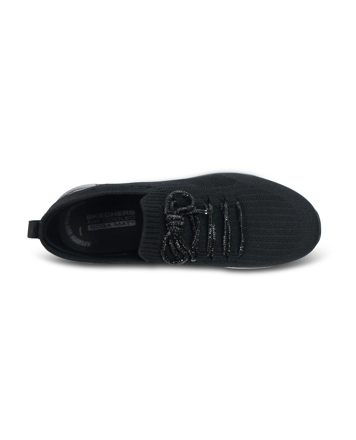 A black knit slip-on sneaker with textured laces and a thick black sole, shown from a three-quarters angle on a white background.