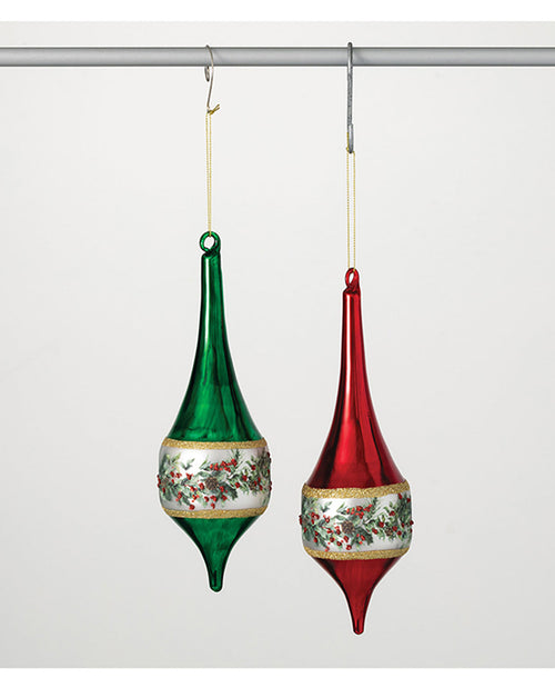 Two glass Christmas ornaments, one green and one red, hanging on a white background.