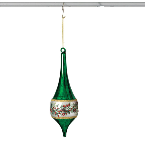 A green glass Christmas ornament with a white band decorated with red berries and green leaves, hanging from a gold-colored string on a metal rod against a white background.