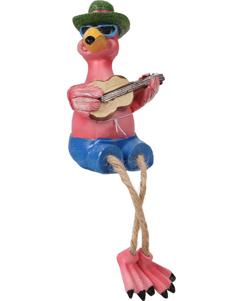 A whimsical flamingo figurine playing a guitar, wearing a green hat, blue pants, and pink shoes, isolated on a white background.