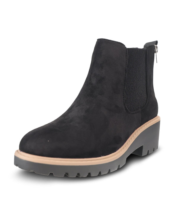 A black suede Chelsea-style ankle boot with a chunky gray lug sole, beige midsole stripe, and side zipper, shown on a white background.