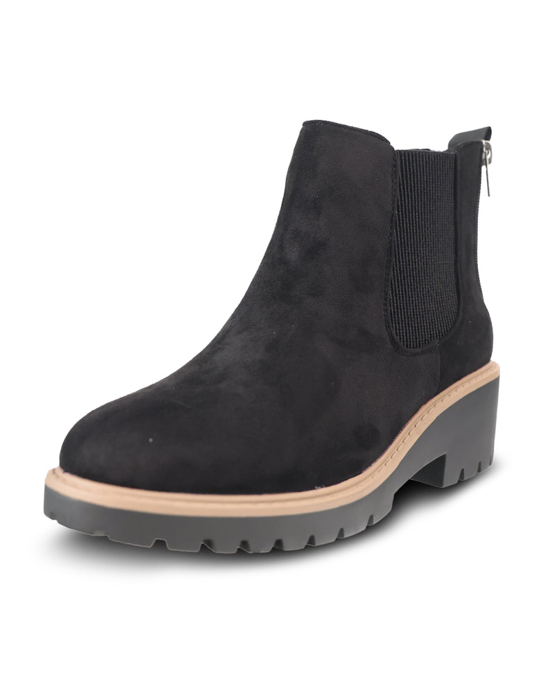 A black suede Chelsea-style ankle boot with a chunky gray lug sole, beige midsole stripe, and side zipper, shown on a white background.