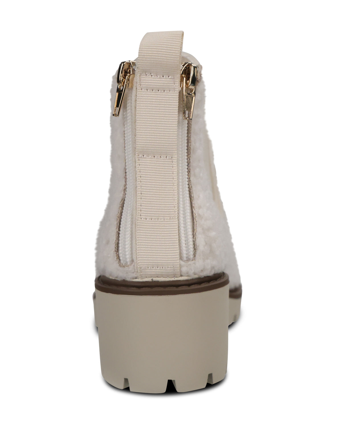 A single beige ankle boot shown from the back, featuring a fluffy faux-fur texture, a wide elastic strap with gold-tone zipper pulls, and a chunky lug sole.