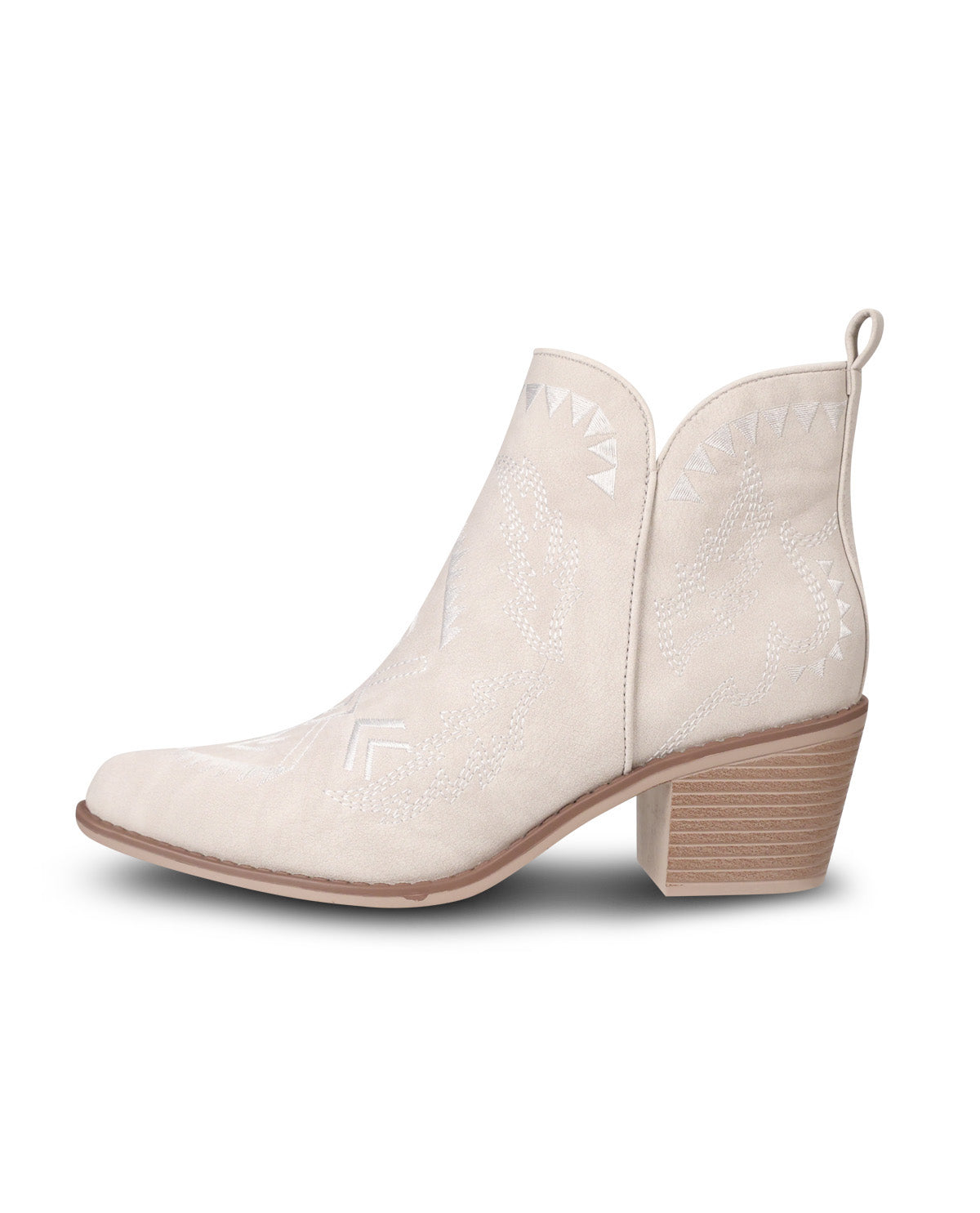 A single light beige western-style ankle boot with a pointed toe, embossed geometric pattern, and a stacked block heel, shown against a plain white background.