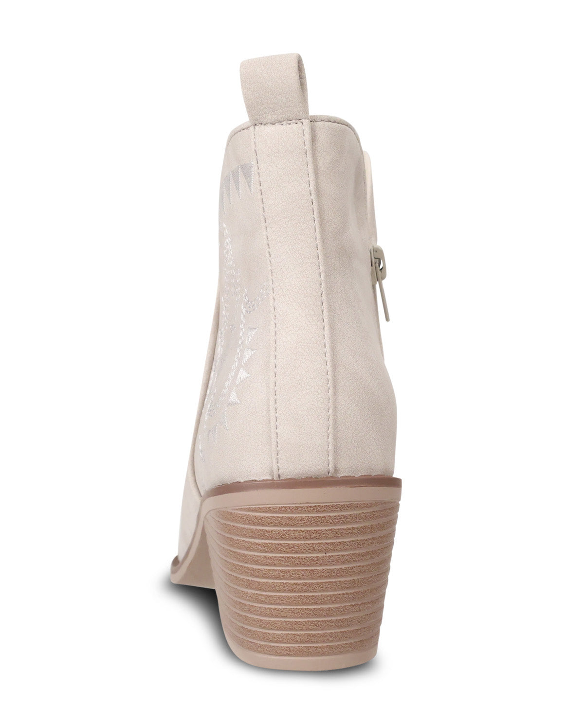 A single beige suede ankle boot shown from the back, featuring a stacked block heel, side zipper, and subtle western-style embroidery on the side panel.