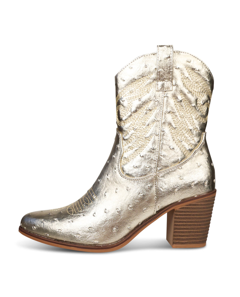 Gold metallic cowboy boot on a white background
