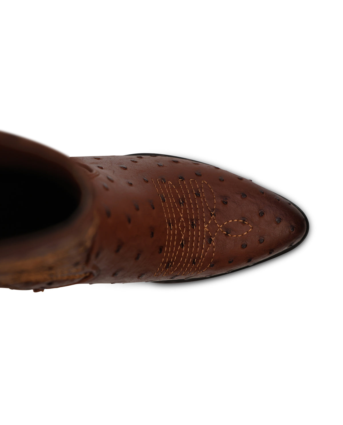 A close-up top-down view of a brown leather ankle boot with an ostrich-quill pattern and decorative stitching on the toe, set against a plain white background.
