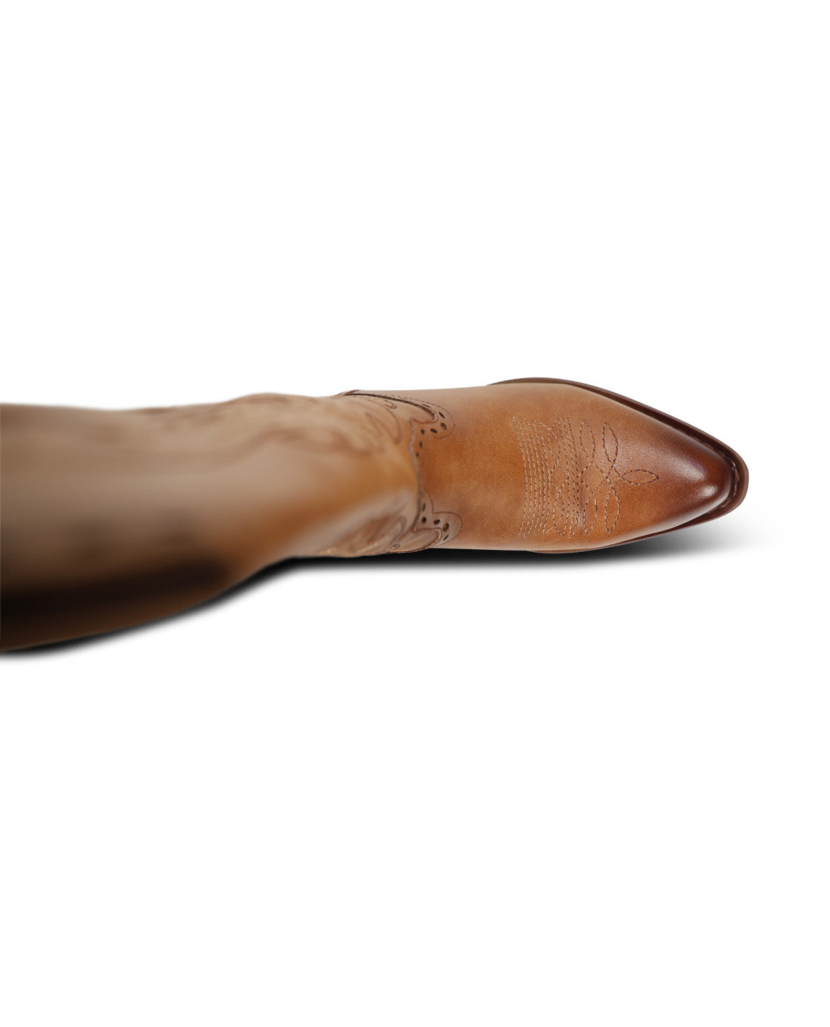 A single light brown leather cowboy boot with decorative western-style stitching, shown from the top down against a plain white background.
