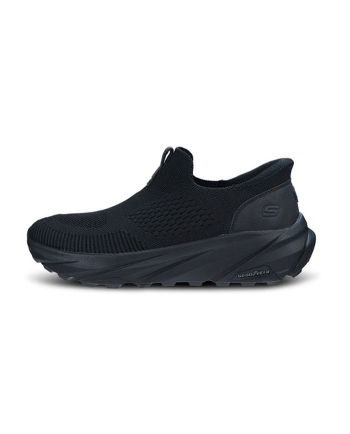 Black sneaker with unique sole design on a white background